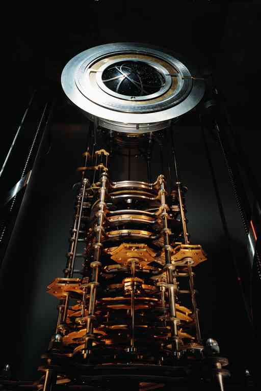 A pendulum clock with a face ringed in silver.