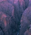 The entrance to a deep chasm.